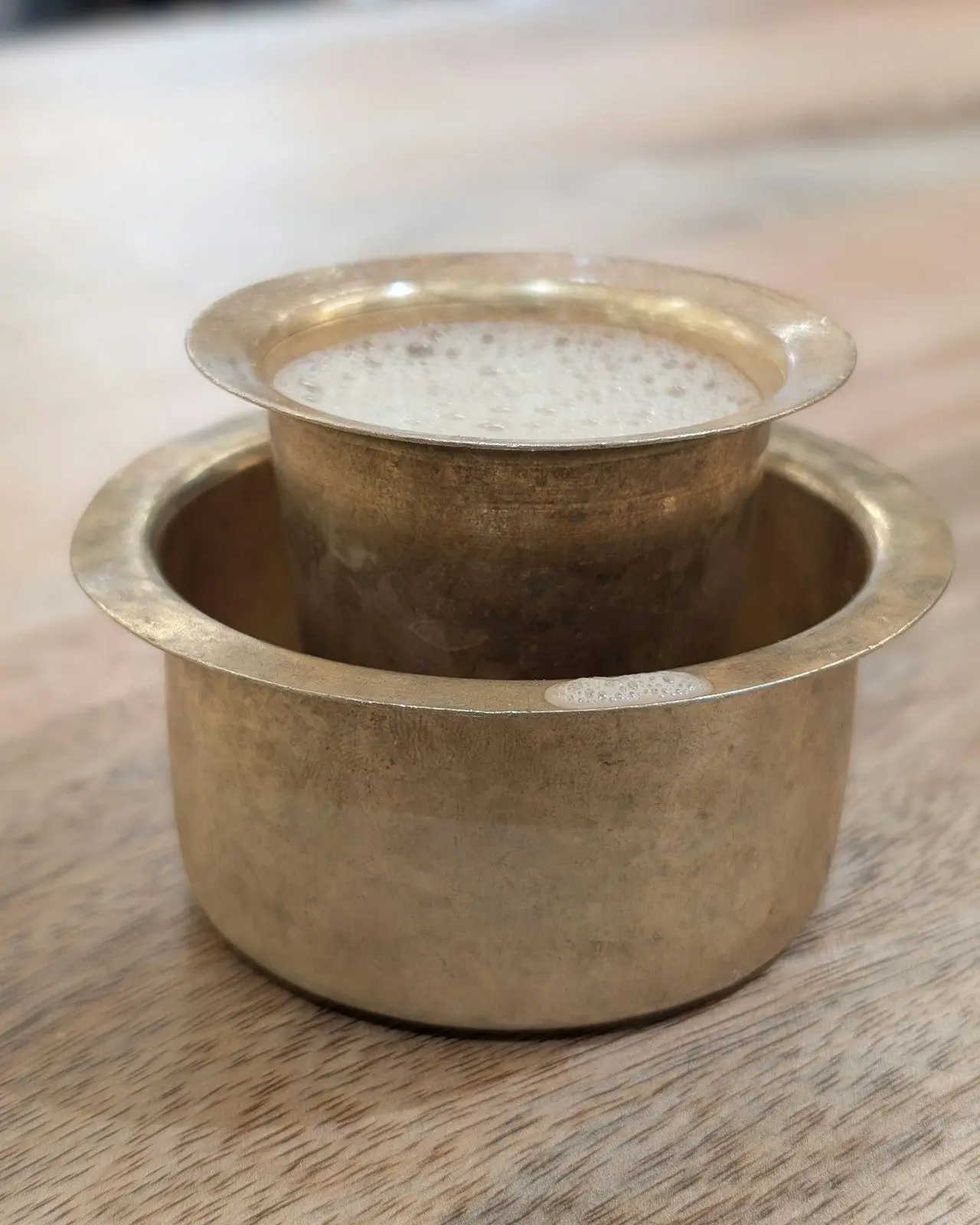South Indian filter coffee served in a traditional tumbler and dabarah